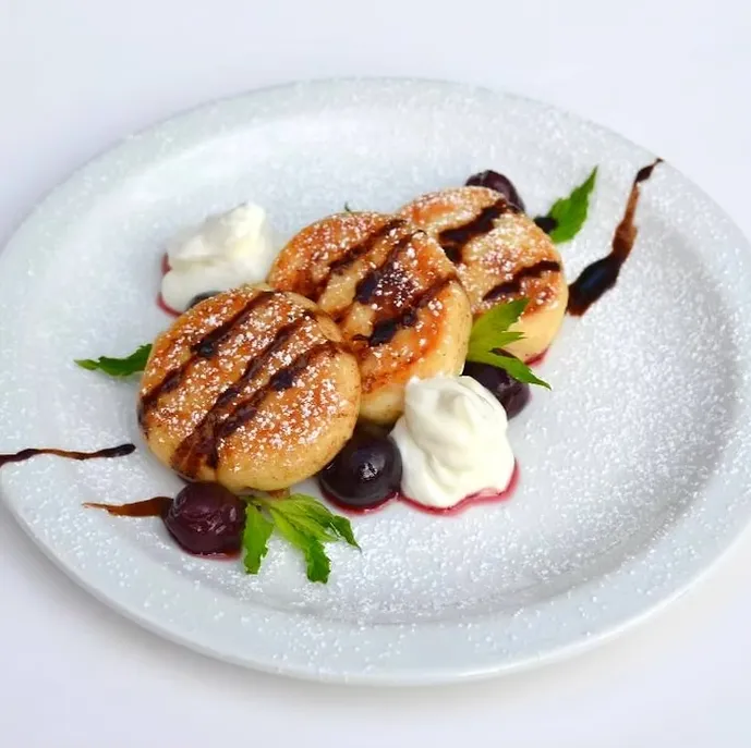 Syrnyky Cheese Pancakes at MLYN Ukrainian Restaurant in Winnipeg - Authentic Ukrainian cuisine on Corydon Avenue